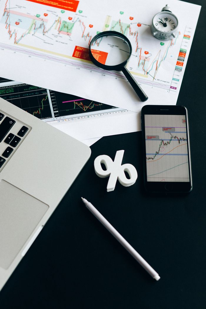heros-img An organized workspace featuring charts, gadgets, and financial data for modern analysis.